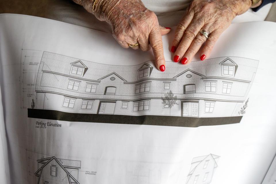 Helen Motzenbecker, 94, shows plans for her latest affordable housing project on Route 71 in Spring Lake Heights at her home in Spring Lake, NJ Thursday, December 22, 2022.