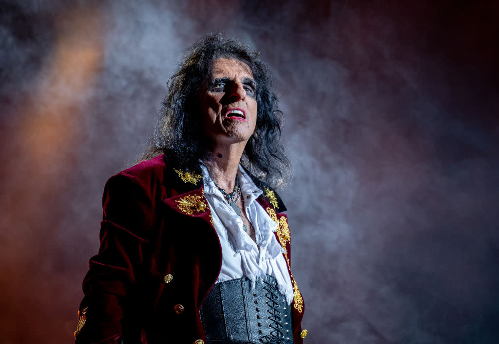 A picture of Alice Cooper on stage. 