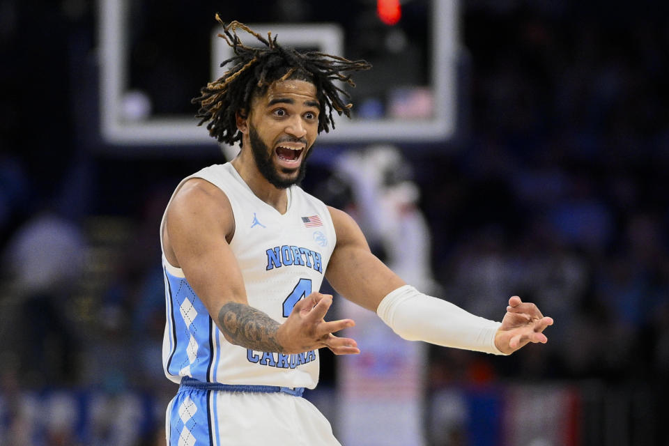 North Carolina guard RJ Davis celebrates his 3-point basket during the second half of an NCAA college basketball game against Florida State in the quarterfinal round of the Atlantic Coast Conference tournament, Thursday, March 14, 2024, in Washington. (AP Photo/Nick Wass)