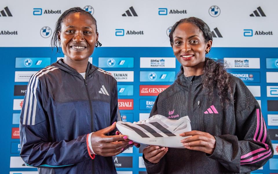 Sheila Chepkirui of Kenya and Tigist Assefa of Ethiopia hold Adidas Adizero Adios Pro Evo 1 Lightstrike Pro Running Shoes ahead of BMW Berlin-Marathon 2023 on September 21, 2023 in Berlin, Germany