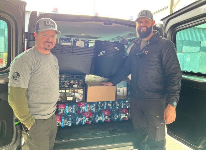 Frank Tate, left and Josh Martinez, right, both of Clarksville, have been supporting refugees from Ukraine during the Russian invasion.