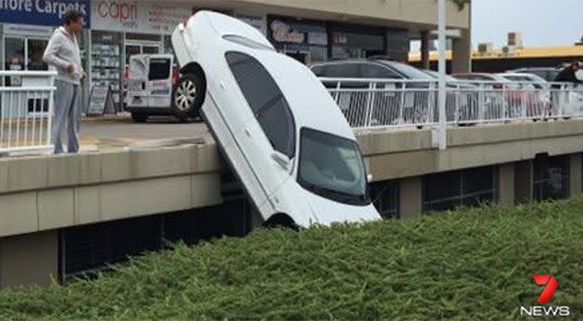 Vehicle plunges off Gold Coast car park into garden bed. Source: 7 News.