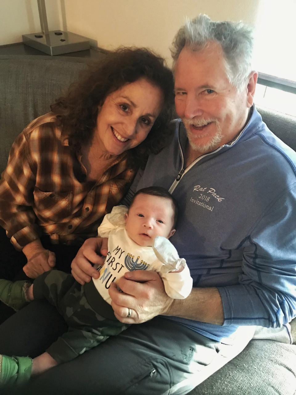 Steve Schlosberg sits with his wife, Leslie, and their grandson, Maxwell, in happier times. The Port Hueneme man is recovering from COVID-19
