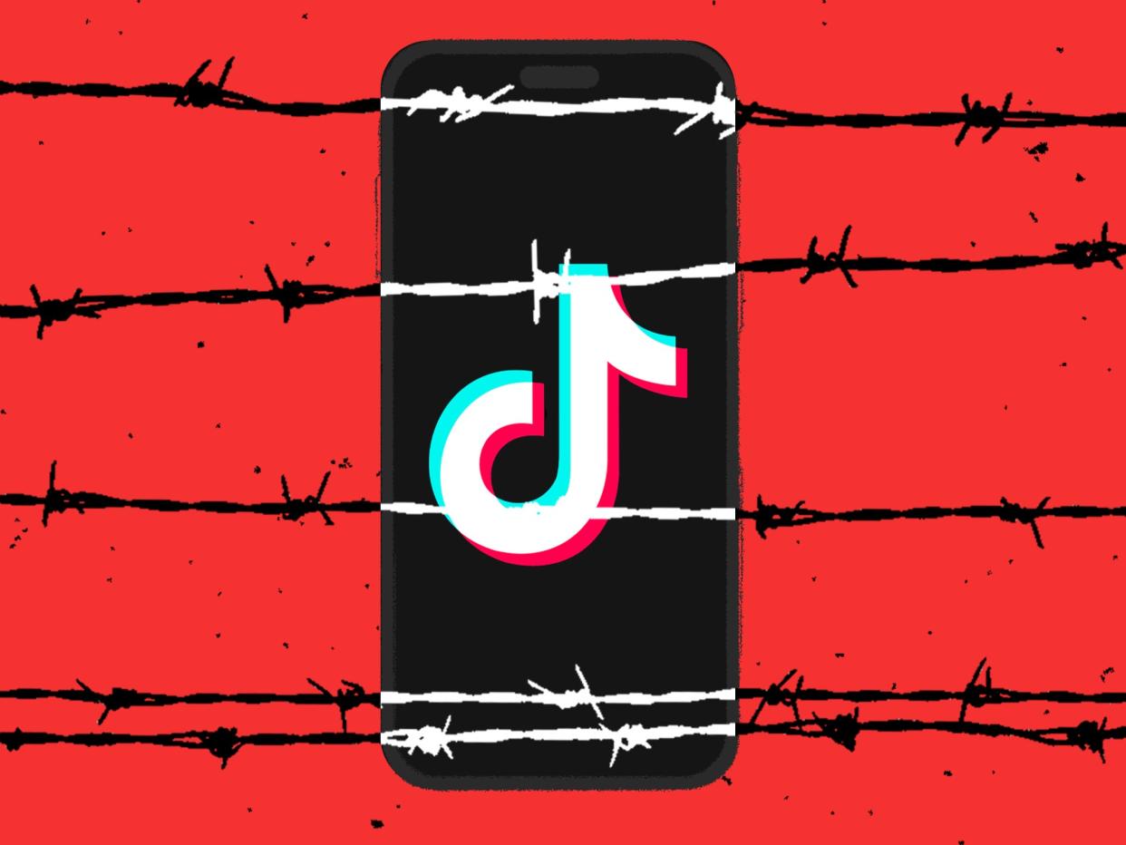 A photo illustration of a phone displaying a TikTok logo behind barbed wire.