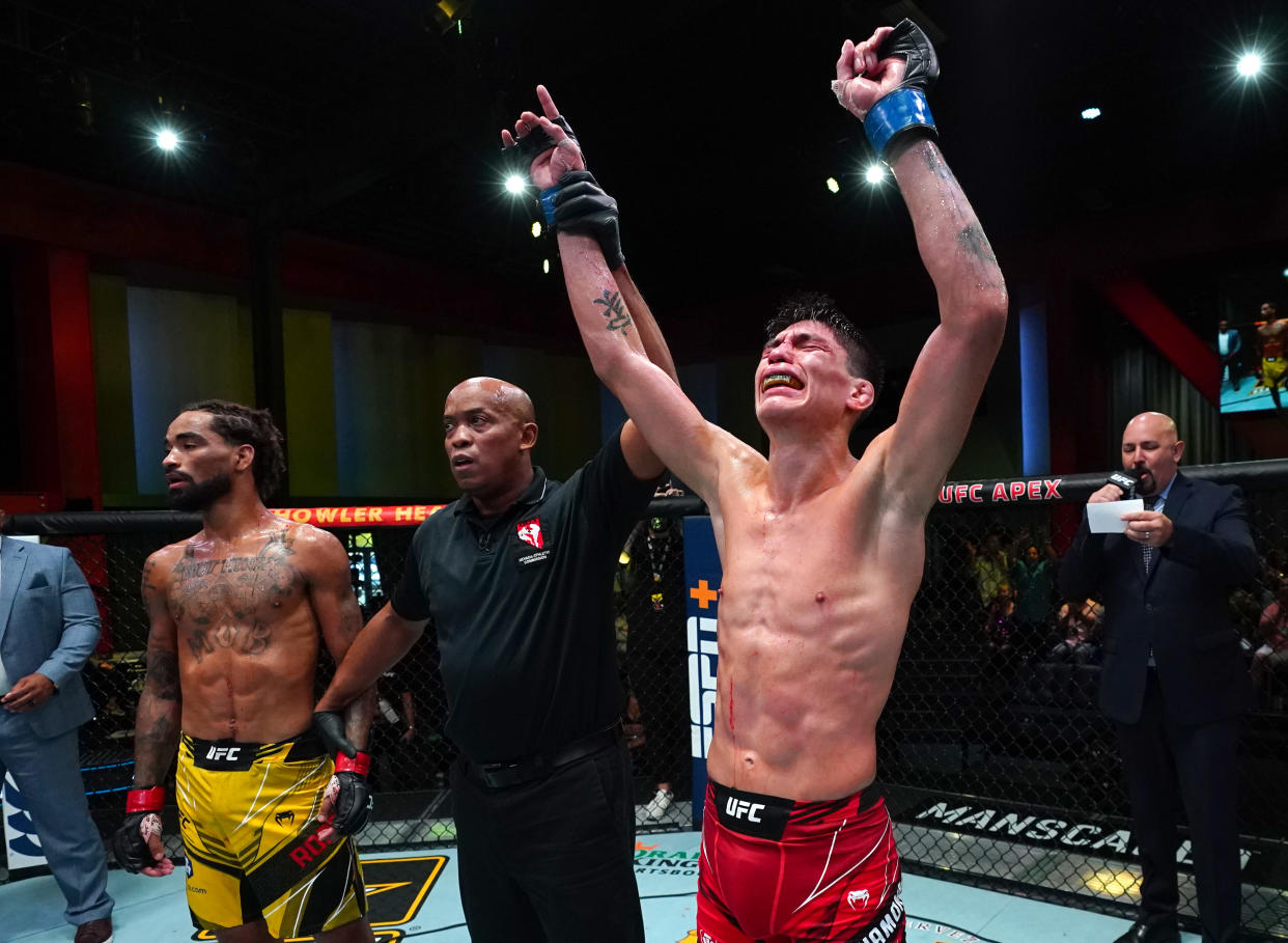 Ignacio Bahamondes of Chile reacts after his knockout victory over Roosevelt Roberts