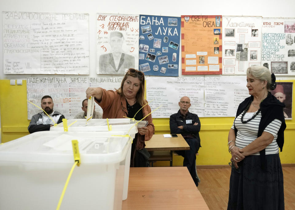 A woman casts her ballot for a general election at a poling station in the Bosnian town of Banja Luka, 240 kms northwest of Sarajevo, Sunday, Oct. 2, 2022. Polls opened Sunday in Bosnia for a general election that is unlikely to bring any structural change despite palpable disappointment in the small, ethnically divided Balkan country with the long-established cast of sectarian political leaders. Polls opened Sunday in Bosnia for a general election that is unlikely to bring any structural change despite palpable disappointment in the small, ethnically divided Balkan country with the long-established cast of sectarian political leaders. (AP Photo/Darko Vojinovic)