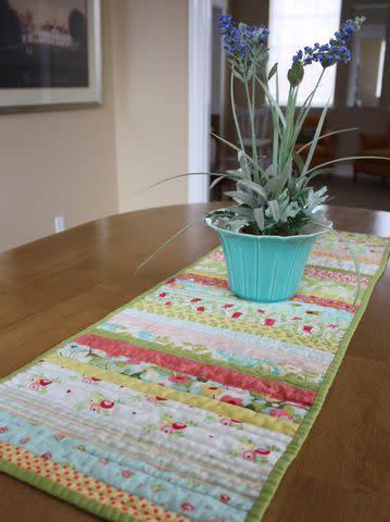 <p><a href="https://www.diaryofaquilter.com/quilted-table-runner/" data-component="link" data-source="inlineLink" data-type="externalLink" data-ordinal="1">Diary of a Quilter</a></p>