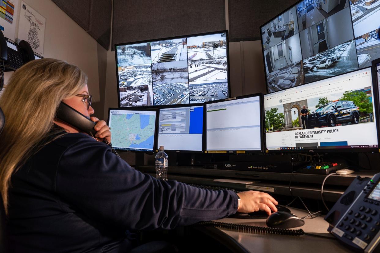 Oakland University dispatcher Tiffany Armstrong keeps an eye on cameras around campus in her office at the Oakland University Police Department in Auburn Hills on Tuesday, Jan. 16, 2024.
