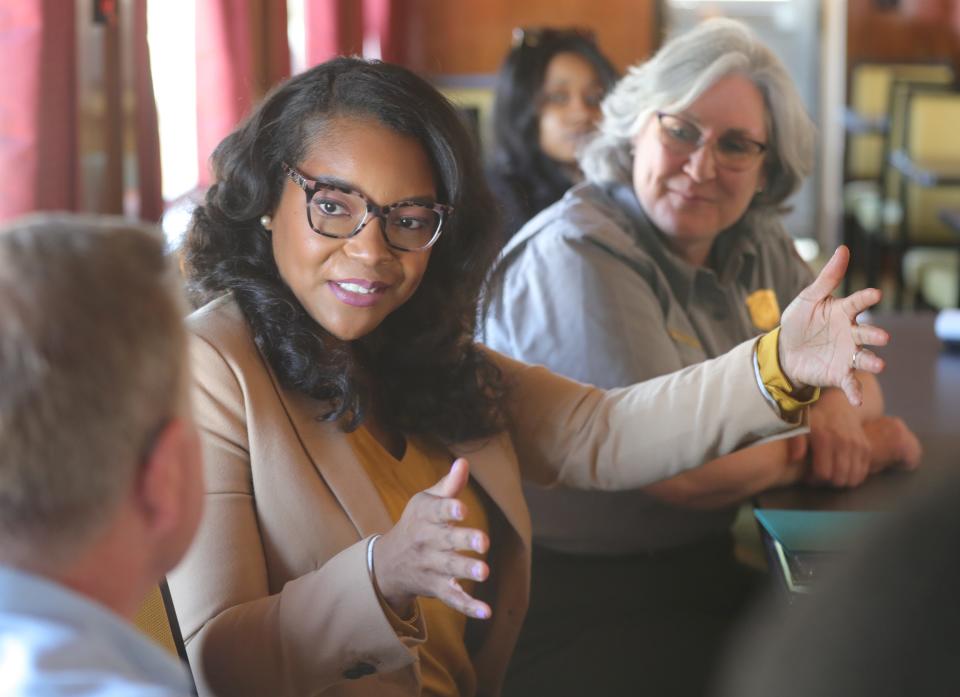 U.S. Rep. Emilia Sykes talks with Cuyahoga Valley Scenic Railroad CEO Joe Mazur, left, and Cuyahoga Valley National Park Superintendent Lisa Petit during a train ride in the national park Monday.
