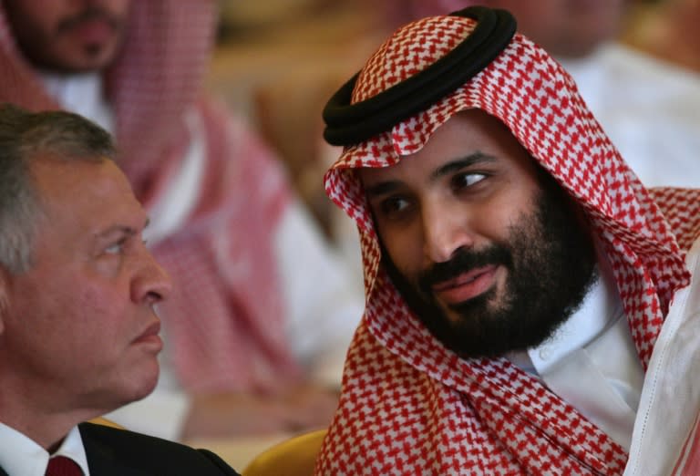 Saudi Crown Prince Mohammed bin Salman chats with Jordan's King Abdullah II at the Future Investment Initiative FII conference in Riyadh on October 23, 2018