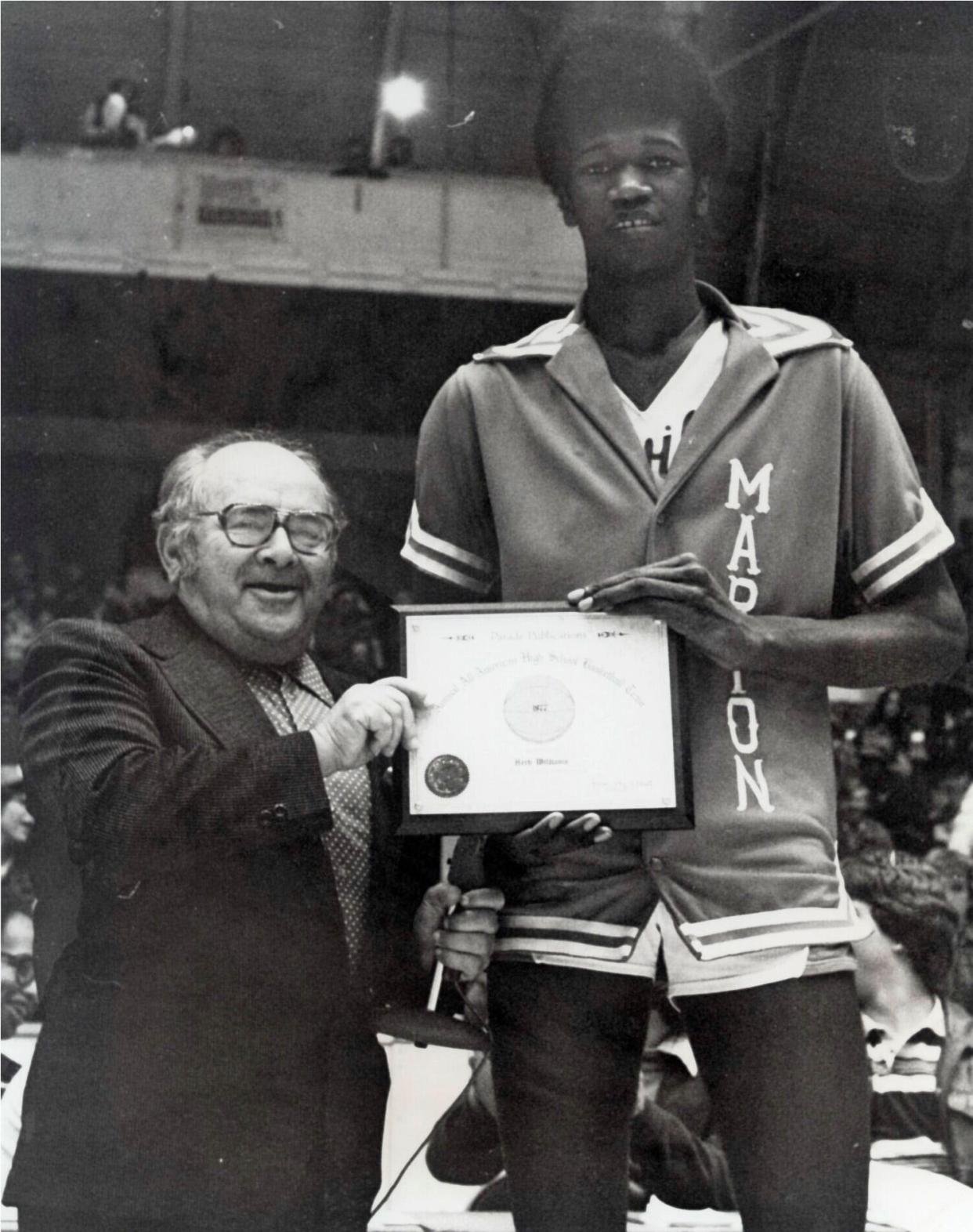This April 7, 1977, photo shows Lou Berliner, left, with Herb Williams of Marion-Franklin High School. The plaque honors Williams' selection for the All-American High School Basketball Team. A local legend, Williams went on to play for Ohio State and the Indiana Pacers.