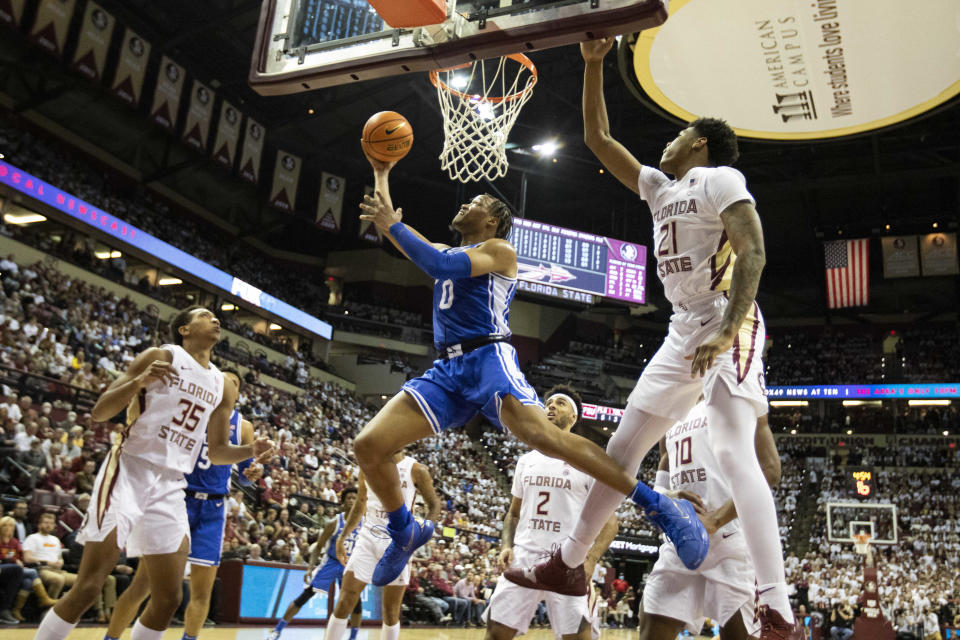 Duke forward Wendell Moore Jr. (0) gets past Florida State guard Cam'Ron Fletcher (21) for a shot in the first half of an NCAA college basketball game in Tallahassee, Fla., Tuesday Jan. 18, 2022. (AP Photo/Mark Wallheiser)