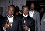 <p>Tupac Shakur and Snoop Dogg at the 23rd Annual American Music Awards in 1996. Between them: MC Hammer with a cigar. </p>