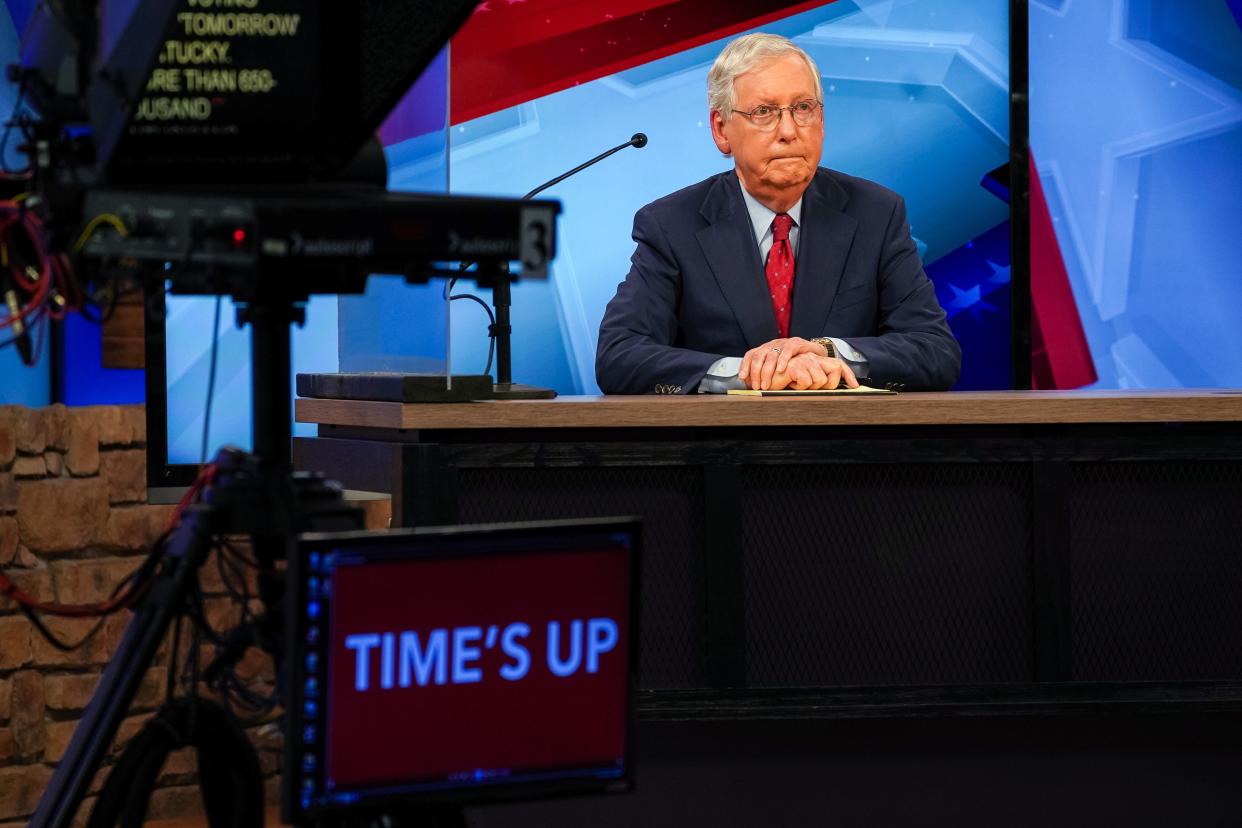 Mitch McConnell at a televised debate with Amy McGrath (REUTERS)