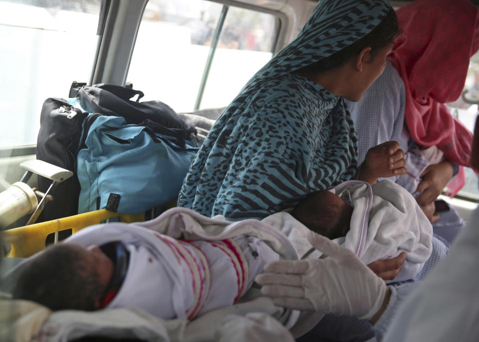 Babies are taken away by ambulance after gunmen attacked a maternity hospital, in Kabul, Afghanistan, Tuesday, May 12, 2020. Gunmen stormed the hospital in the western part of Kabul on Tuesday, setting off a shootout with the police and killing several people. (AP Photo/Rahmat Gul)