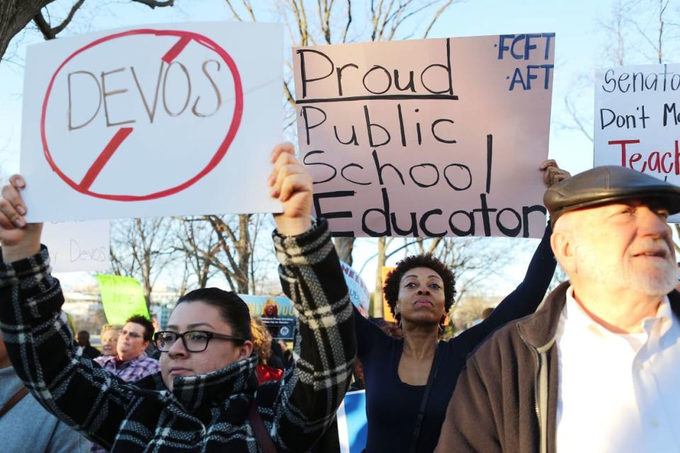 <div class="inline-image__caption"><p>Protesters demonstrate against President Trump’s nominee for secretary of education, Betsy DeVos, on Capitol Hill on Feb. 6, 2017, in Washington, D.C.</p></div> <div class="inline-image__credit">Mario Tama/Getty</div>