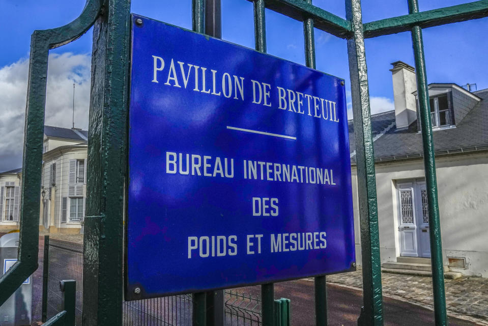 The entrance of the International Bureau of Weights and Measures is pictured in Sevres, outside Paris, Thursday, Nov. 17, 2022. Officials from 64 member states are convening at a conference organized by the supreme authority of the International Bureau of Weights and Measures (BIPM) and scientists have expanded the world's unit systems the first time this century — as the global population surges past 8 billion. (AP Photo/Michel Euler)