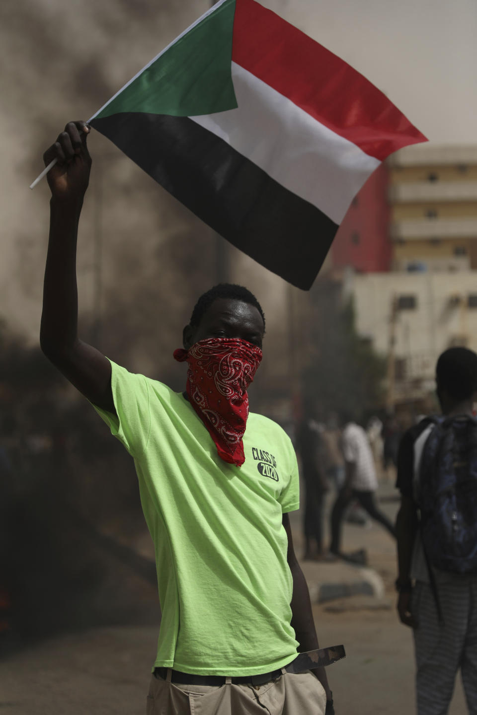 Sudanese take part in a protest over economic conditions, in Khartoum, Sudan, Wednesday, June 30, 2021. The World Bank and the International Monetary Fund said in a joint statement Tuesday, that Sudan has met the initial criteria for over $50 billion in foreign debt relief, another step for the East African nation to rejoin the international community after nearly three decades of isolation. (AP Photo/Marwan Ali)