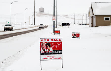 FILE PHOTO: A sign advertises homes for sale in a new housing development in Dickinson, North Dakota January 21, 2016. REUTERS/Andrew Cullen