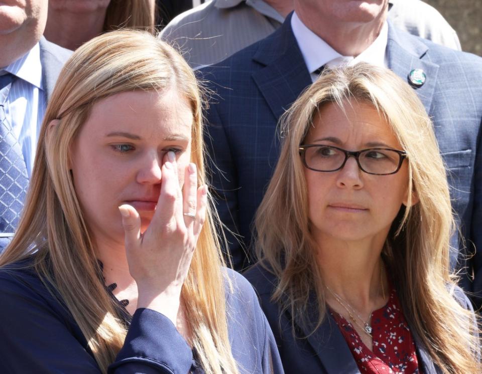 Diller’s widow Stephanie wiping away tears at a press conference after the arraignment. Brigitte Stelzer