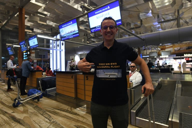 Have T-shirt, will fly: Pier Messaggio is part of a group called "First to Fly" whose members have been on all Singapore Airlines' inaugural flights