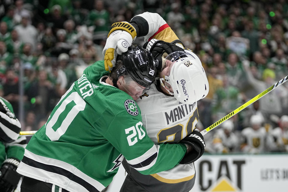 Dallas Stars defenseman Ryan Suter (20) and Vegas Golden Knights right wing Anthony Mantha (39) scuffle during the second period in Game 2 of an NHL hockey Stanley Cup first-round playoff series in Dallas, Wednesday, April 24, 2024. (AP Photo/Tony Gutierrez)