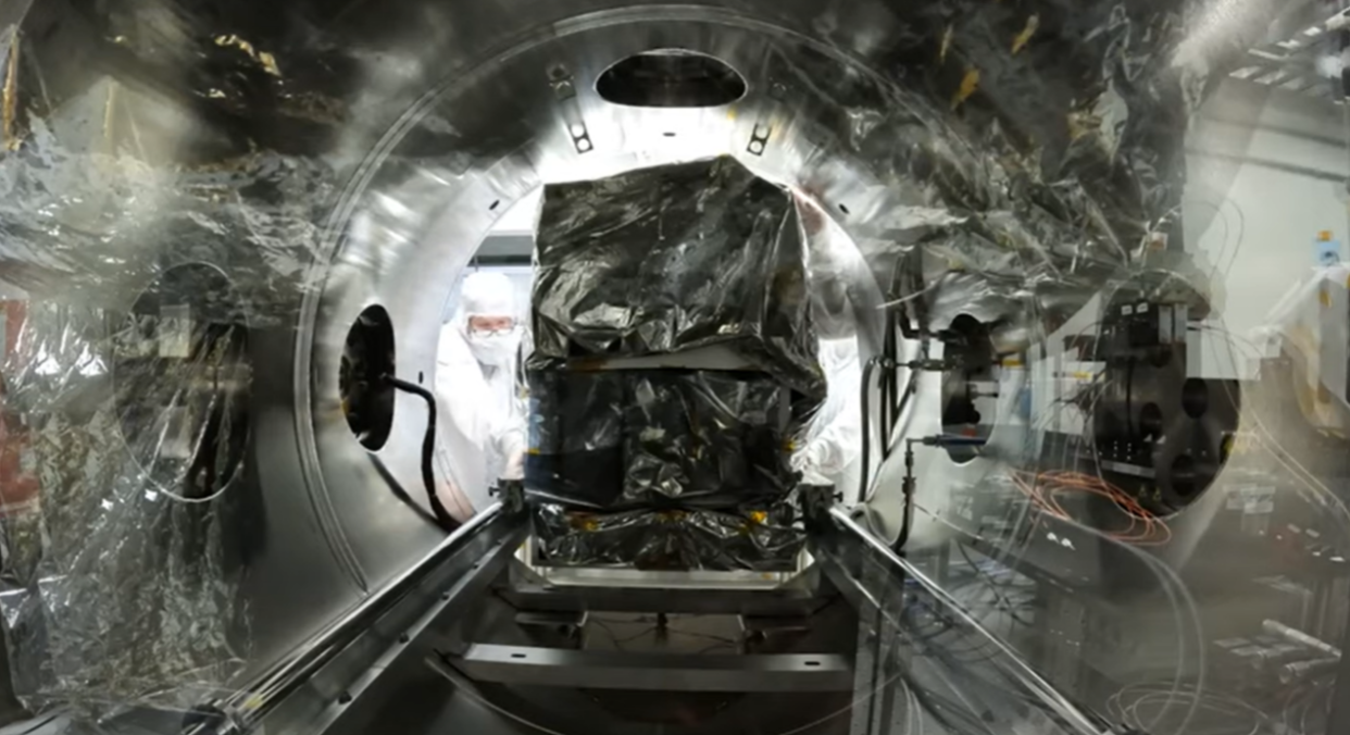  A view of the spectrometer being slid into a vacuum test chamber. The view is from within the chamber. 