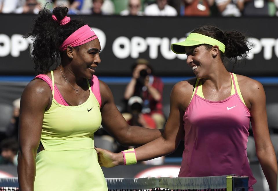 Serena Williams of the U.S., left, is congratulated by her compatriot Madison Keys after winning their semifinal match at the Australian Open tennis championship in Melbourne, Australia, Thursday, Jan. 29, 2015. (AP Photo/Andy Brownbill)