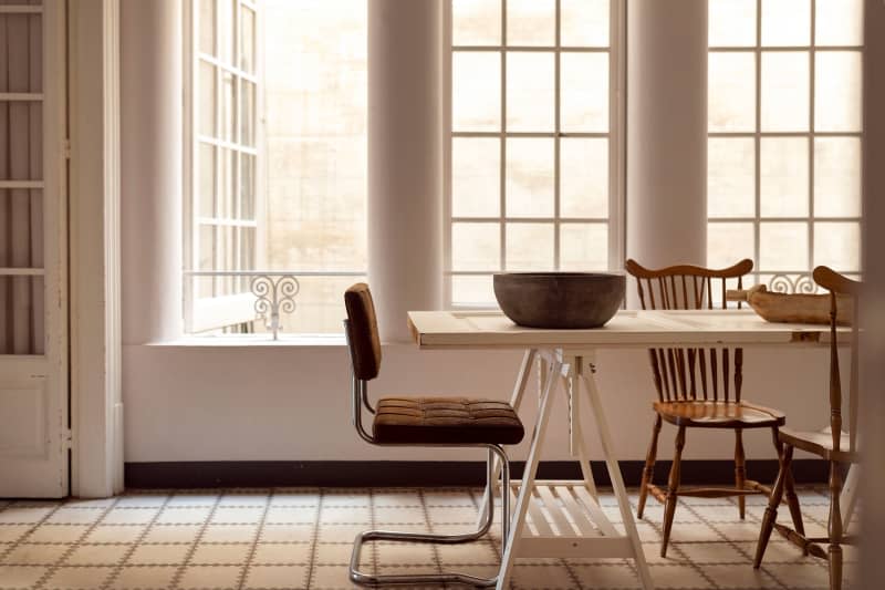 Table seen in dining area of neutral toned room.