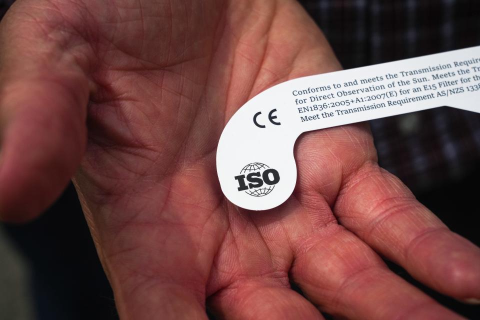 Tovard Hessel, an engineering scientist at the Space and Geophysics lab at the University of Texas at Austin, holds a set of his eclipse glasses on Monday, April 1, 2024. Hessel's glasses meet the ISO 12312-2 international safety standard which makes them safe for eclipse viewing.