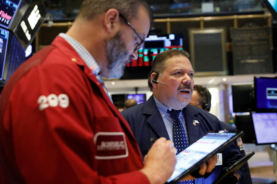 Traders work on the floor of the New York Stock Exchange shortly after the opening bell in New York City, U.S., November 21, 2019.  REUTERS/Lucas Jackson