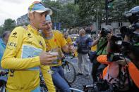 Astana team manager Alexander Vinokourov and 2014 Tour de France cycling race winner Italy's Vincenzo Nibali pose for photographers during the team parade of the Tour de France cycling race in Paris, France, Sunday, July 27, 2014. (AP Photo/Christophe Ena)