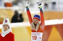 Alpine Skiing - Pyeongchang 2018 Winter Olympics - Women's Downhill - Jeongseon Alpine Centre - Pyeongchang, South Korea - February 21, 2018 - Silver medallist Ragnhild Mowinckel of Norway celebrates during the flower ceremony. REUTERS/Kai Pfaffenbach