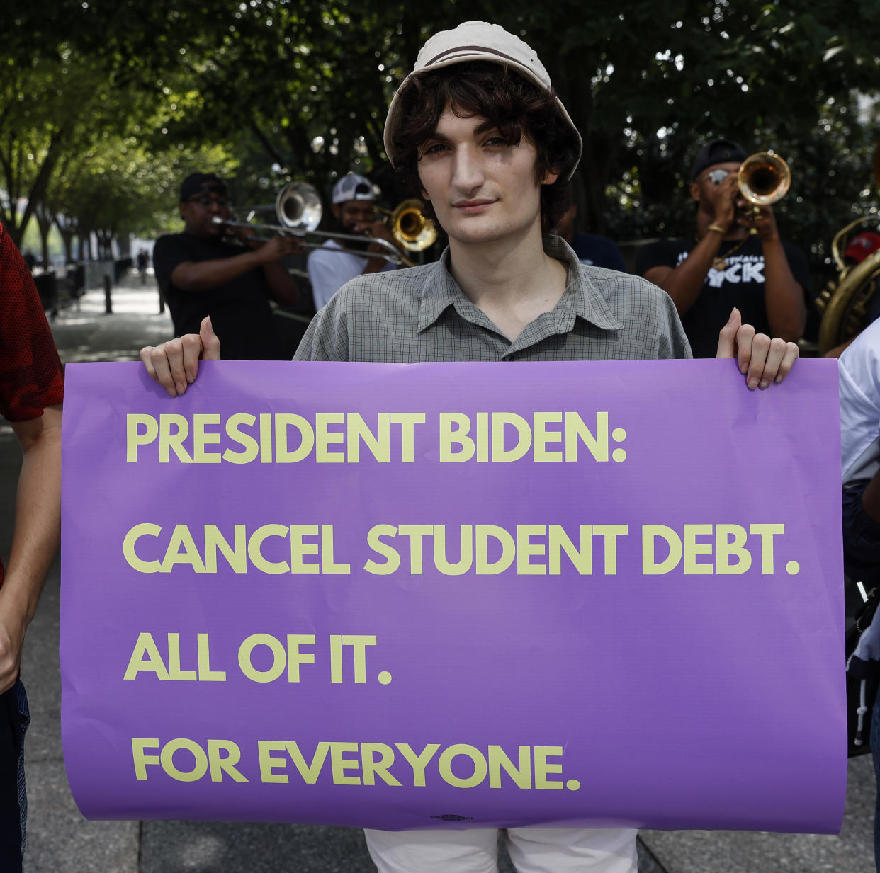 WASHINGTON, DC - JULY 27: Student loan debt holders take part in a demonstration outside of the white house staff entrance to demand that President Biden cancel student loan debt in August on July 27, 2022 at the Executive Offices in Washington, DC. (Photo by Jemal Countess/Getty Images for We, The 45 Million)