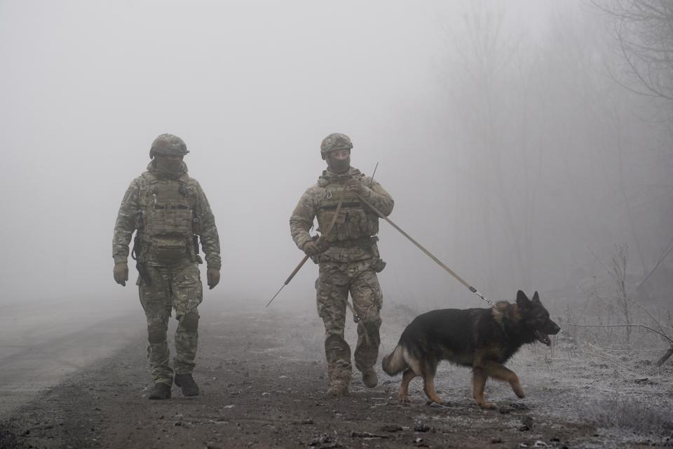 Ukrainian soldiers guard an area near Odradivka, eastern Ukraine, Sunday, Dec. 29, 2019. Ukrainian forces and Russia-backed rebels in eastern Ukraine have begun exchanging prisoners in a move aimed at ending their five-year-long war. The move is part of an agreement brokered earlier this month at a summit of the leaders of Ukraine, Russia, Germany and France. (AP Photo/Evgeniy Maloletka)