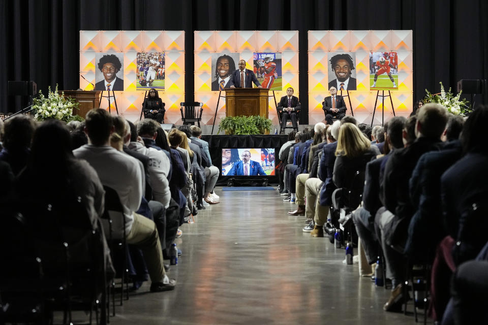 FILE - University of Virginia football coach Tony Elliott speaks during a memorial service for three slain University of Virginia football players, Lavel Davis Jr., D'Sean Perry and Devin Chandler at John Paul Jones Arena at the school in Charlottesville, Va., Saturday, Nov. 19, 2022. The Virginia Cavaliers finally are getting back on a field to play. Saturday's opener against Tennessee will be both teams first game in 294 days. They're trying to move on from a shooting that left three players dead and ended their season early.(AP Photo/Steve Helber, Pool, File)