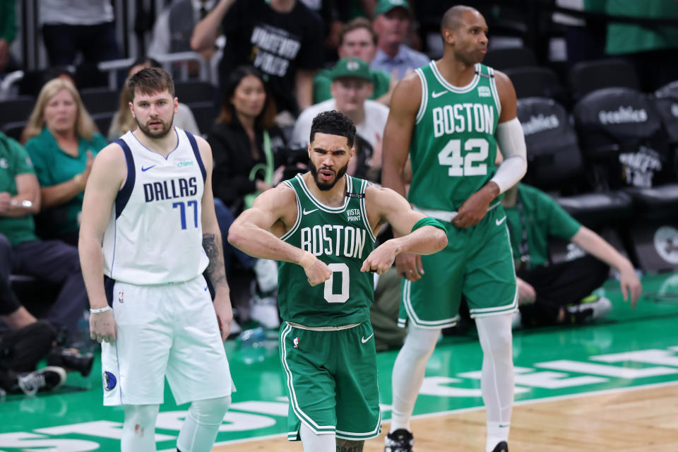 BOSTON, MASSACHUSETTS - JUNE 17: Jayson Tatum #0 of the Boston Celtics reacts as Luka Doncic #77 of the Dallas Mavericks looks on during the third quarter of Game Five of the 2024 NBA Finals at TD Garden on June 17, 2024 in Boston, Massachusetts. NOTE TO USER: User expressly acknowledges and agrees that, by downloading and or using this photograph, User is consenting to the terms and conditions of the Getty Images License Agreement. (Photo by Adam Glanzman/Getty Images)