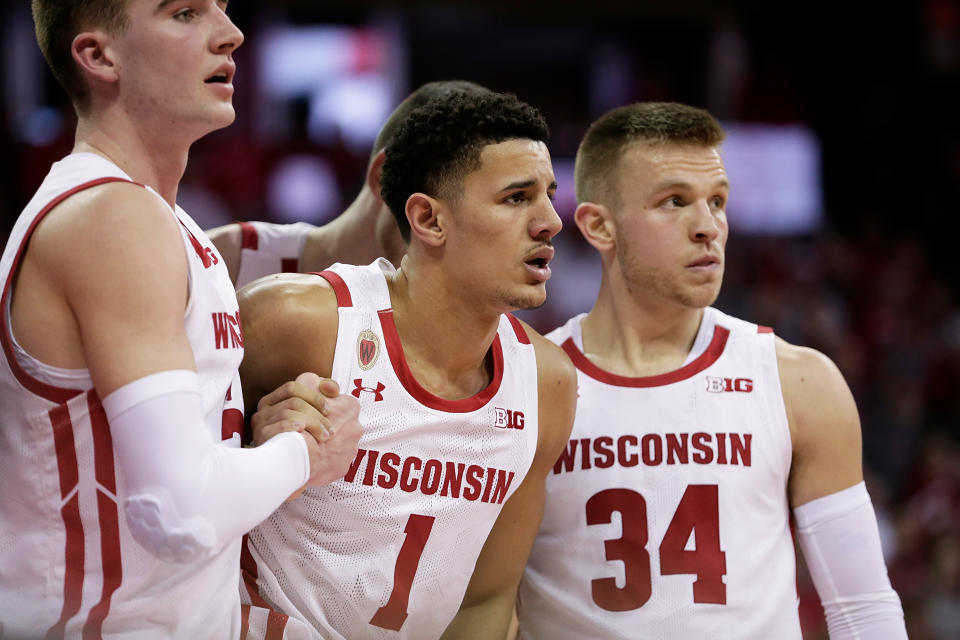 MADISON, WISCONSIN - MARCH 06: Johnny Davis #1 of the Wisconsin Badgers is helped off the court after being fouled. Davis did not return to the game against the Nebraska Cornhuskers at Kohl Center on March 06, 2022 in Madison, Wisconsin. (Photo by John Fisher/Getty Images)