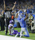 Detroit Lions wide receiver Marvin Jones (11), raises his arms after an catching an 11-yard pass for a touchdown during the first half of an NFL football game against the Minnesota Vikings, Sunday, Oct. 20, 2019, in Detroit. (AP Photo/Duane Burleson)