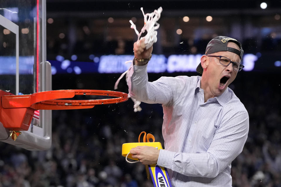 Connecticut head coach Dan Hurley celebrates during the net cutting after their win against San Diego State in the men's national championship college basketball game in the NCAA Tournament on Monday, April 3, 2023, in Houston. (AP Photo/David J. Phillip)