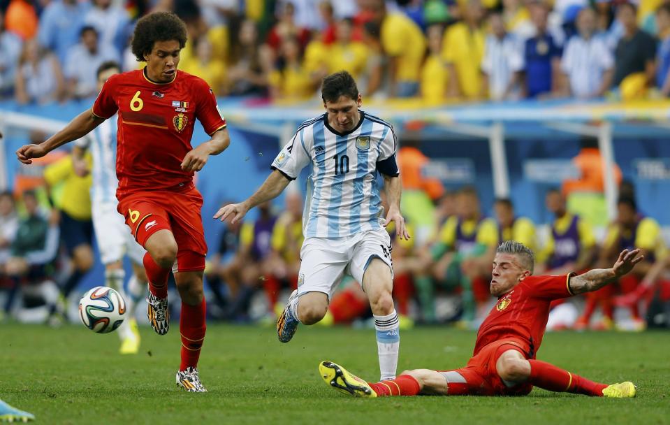 Argentina's Lionel Messi (C) fights for the ball with Belgium's Axel Witsel (L) and Toby Alderweireld during their 2014 World Cup quarter-finals at the Brasilia national stadium in Brasilia July 5, 2014. REUTERS/Dominic Ebenbichler