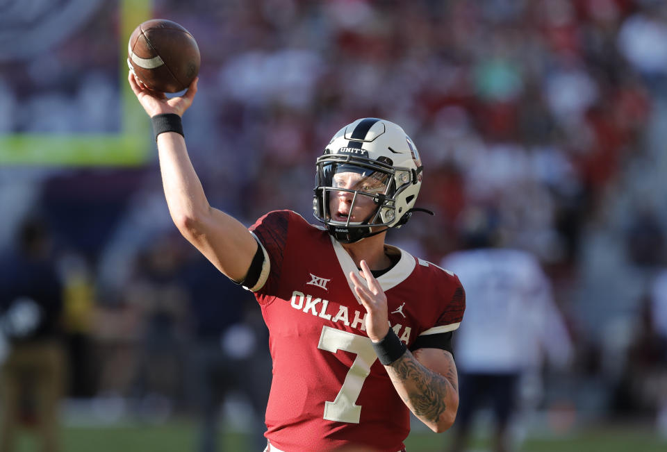 Oklahoma quarterback Spencer Rattler (7) warms up before the start of a game against West Virginia in Norman, Okla., Saturday, Sep. 25, 2021. (AP Photo/Alonzo Adams)