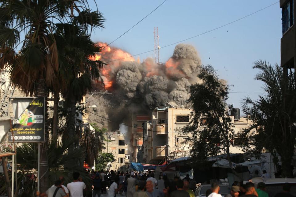 An Israeli air strike targets a residential building in Gaza.