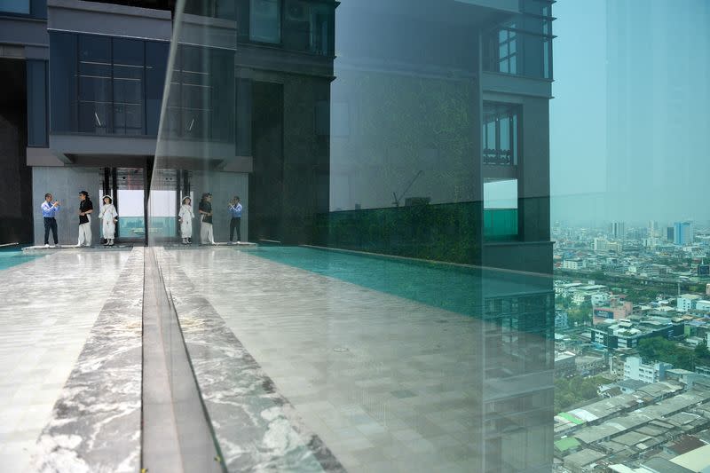 Daniel Bian, a Chinese potential property buyer from Shanghai, visits a luxury condominium in Bangkok