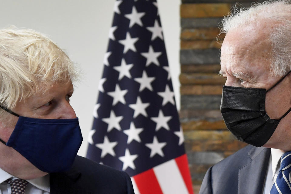 U.S. President Joe Biden, right, talks with Britain's Prime Minister Boris Johnson, during their meeting ahead of the G7 summit in Cornwall, Britain, Thursday June 10, 2021. (Toby Melville/Pool Photo via AP)