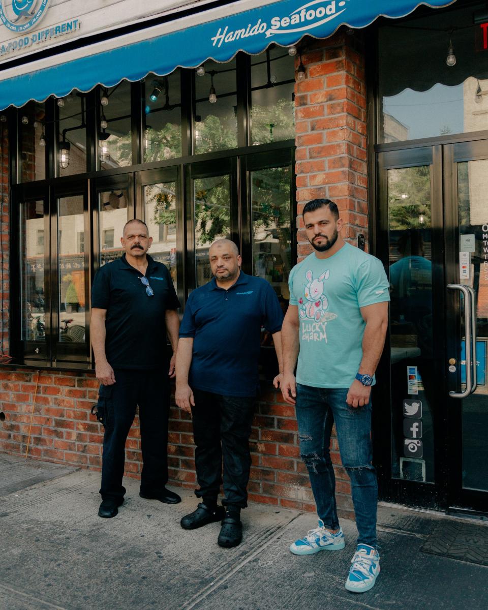 Hamido Seafood portrait of owners.