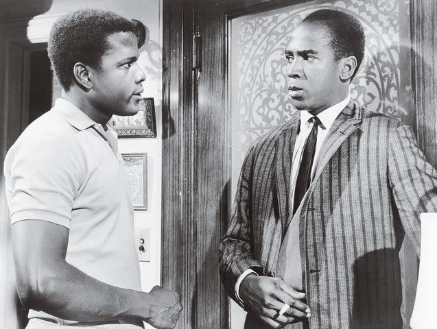 <p>courtesy everett collection</p> Louis Gossett Jr. and Sidney Poitier