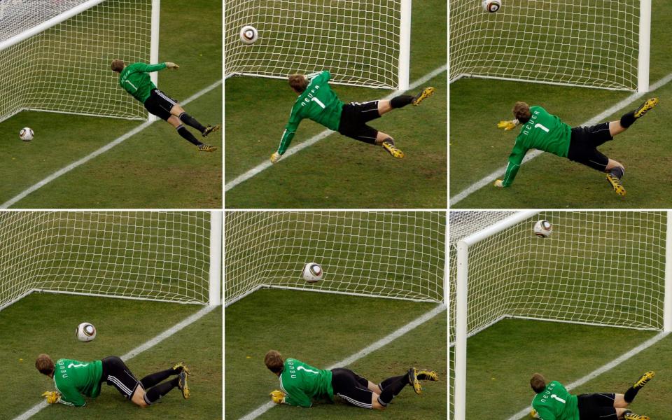 Germany's goalkeeper Manuel Neuer looks at a ball that hit the bar to bounce over the line  - AP