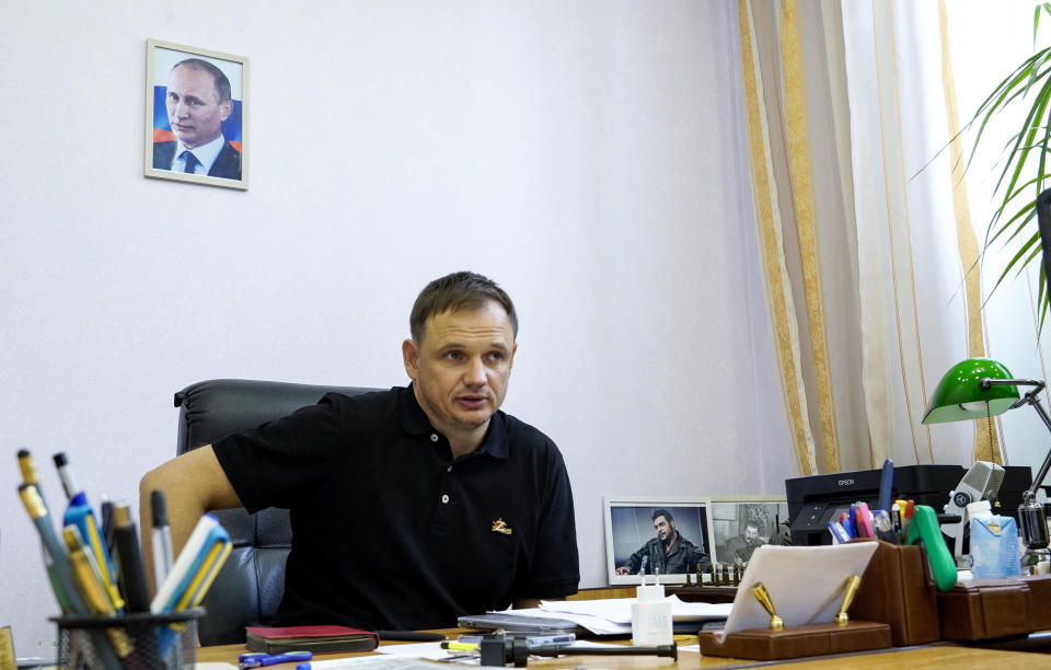 Kirill Stremousov, deputy head of the Russian-backed Kherson administration, is pictured in his office, with a portrait of Russian President Vladimir Putin seen on the wall behind him, in the city of Kherson on July 20, 2022, amid the ongoing Russian military action in Ukraine. (Photo by STRINGER / AFP) (Photo by STRINGER/AFP via Getty Images)