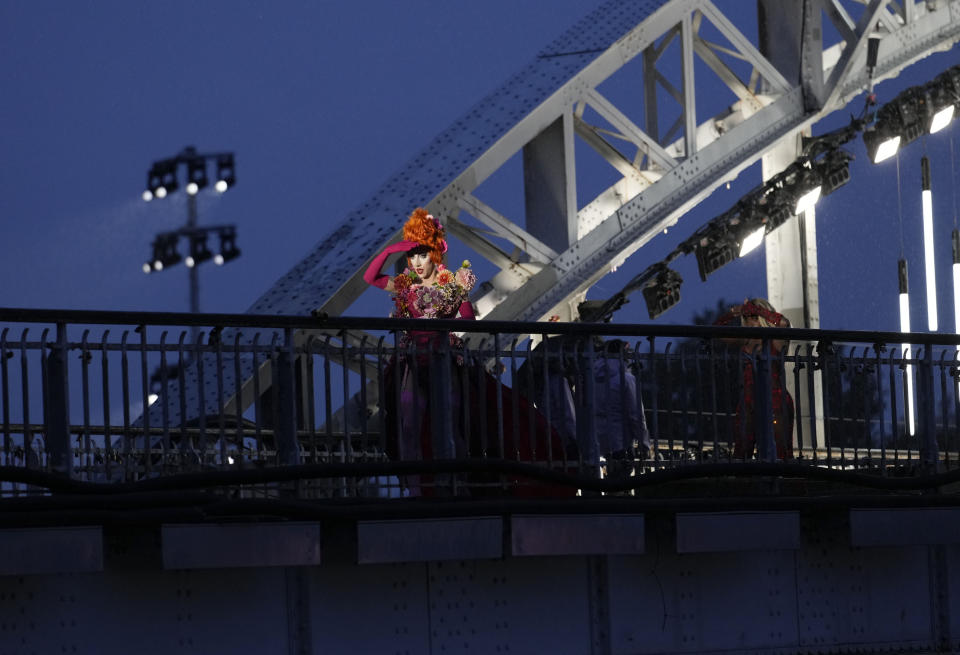 Drag queens prepare to perform on the Debilly Bridge in Paris, during the opening ceremony of the 2024 Summer Olympics, Friday, July 26, 2024. (AP Photo/Tsvangirayi Mukwazhi)